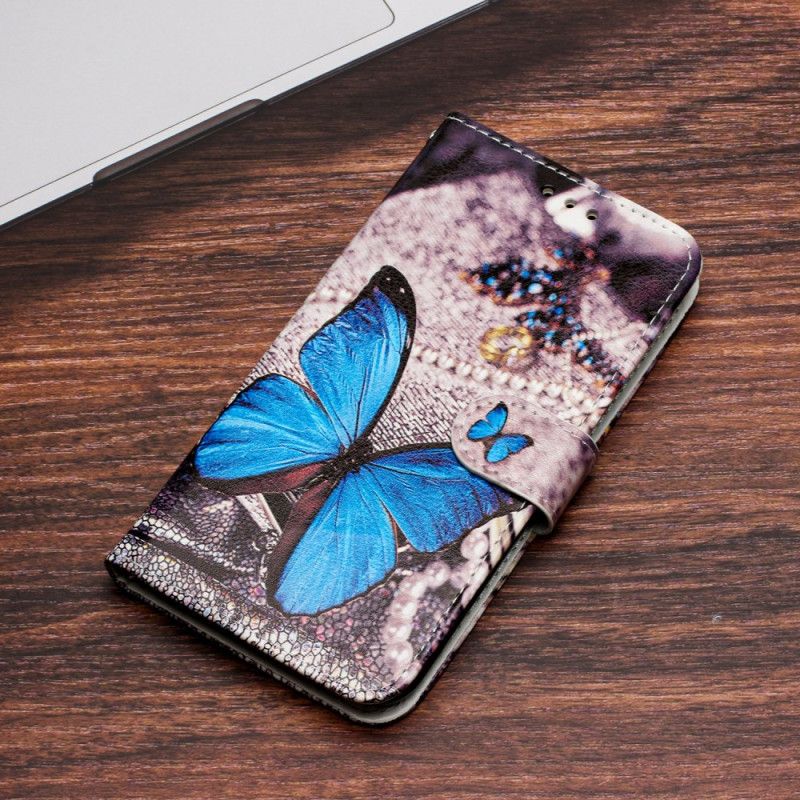 Housse iPhone 16 Papillon Bleu à Lanière