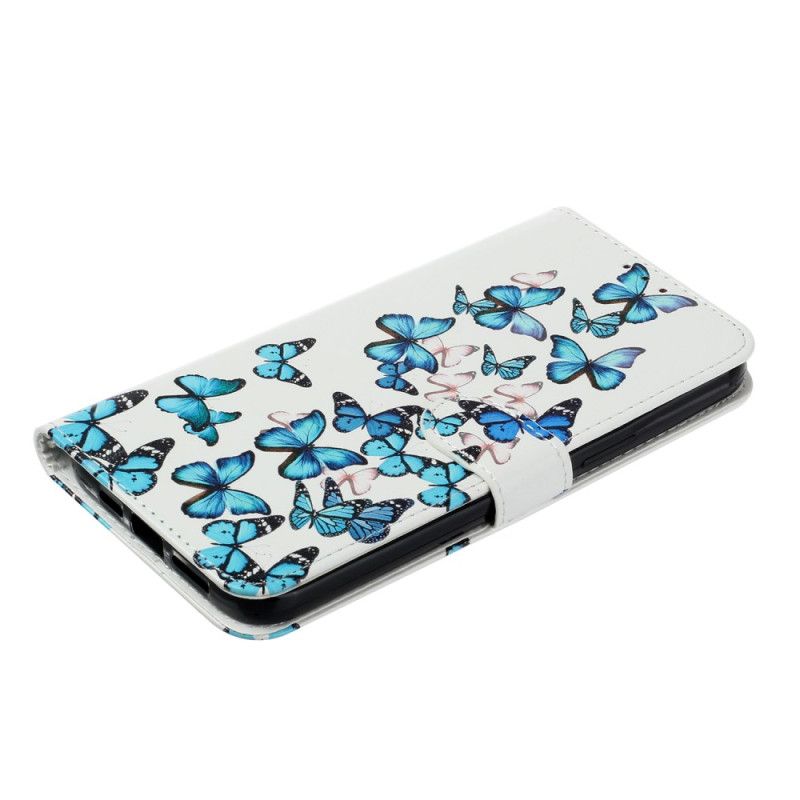 Housse iPhone 16 Plus Vol de Papillons Bleus