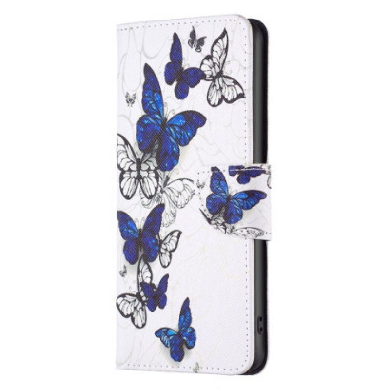 Housse iPhone 16 Pro Max Papillons Bleus en Vol