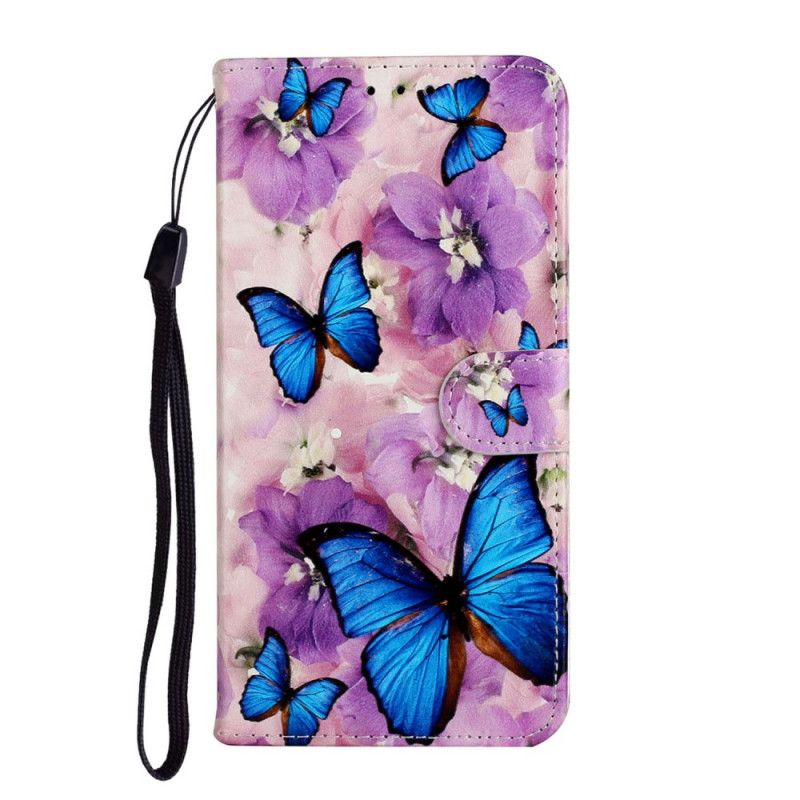 Housse Huawei Y5p Papillons Bleus Dans Les Fleurs