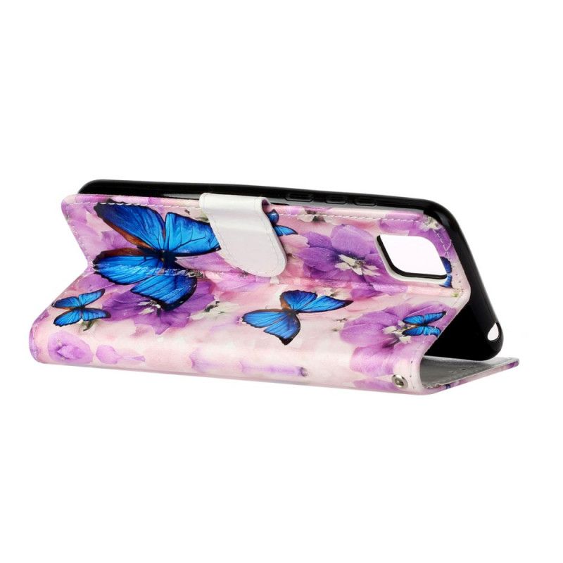 Housse Huawei Y5p Papillons Bleus Dans Les Fleurs