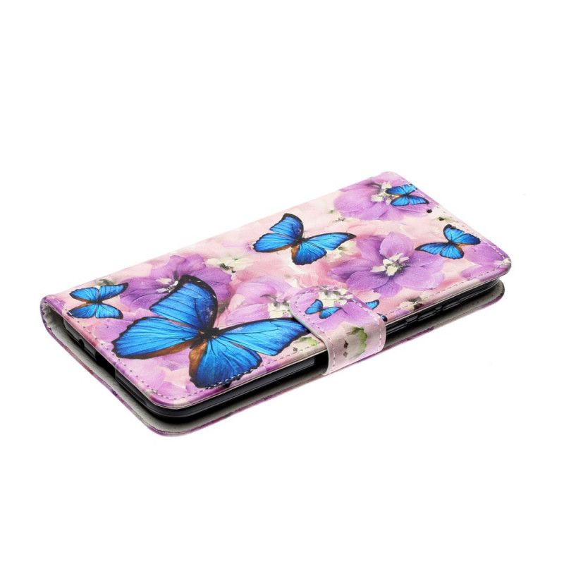 Housse Huawei Y5p Papillons Bleus Dans Les Fleurs