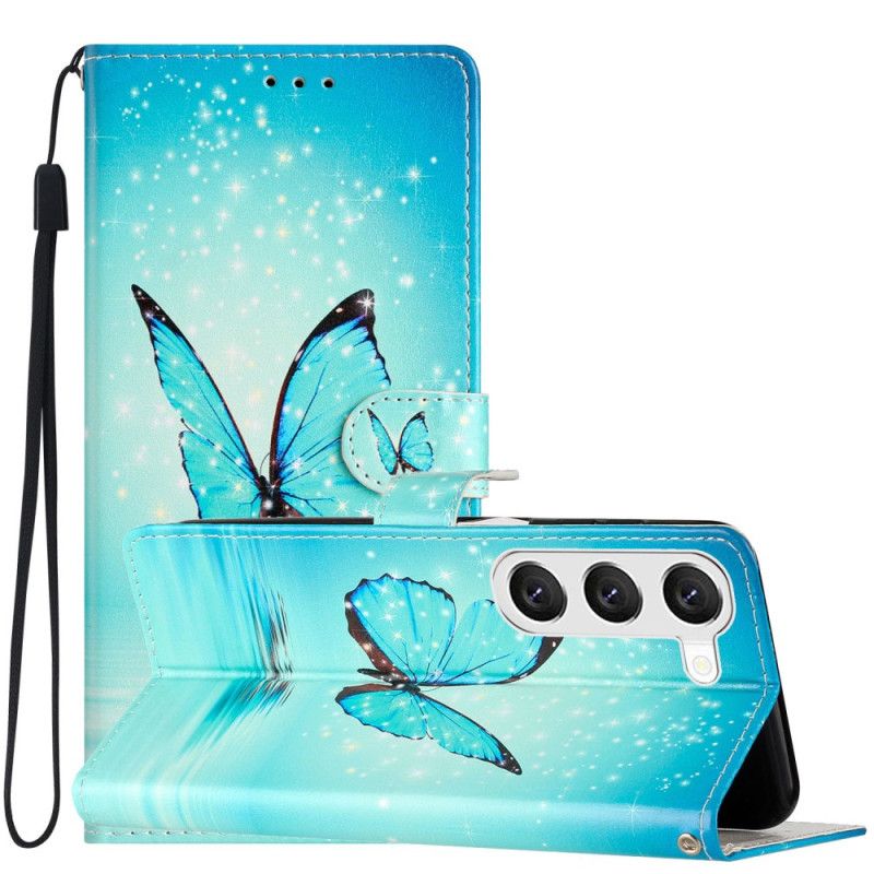 Housse Samsung Galaxy S24 5G Papillons Bleus à Lanière