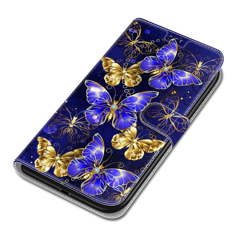 Housse Samsung Galaxy S24 5G Papillons Dorés et Bleus à Lanière