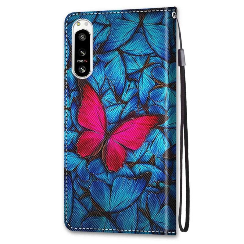 Housse Sony Xperia 5 IV Papillon Rouge Sur Fond Bleu