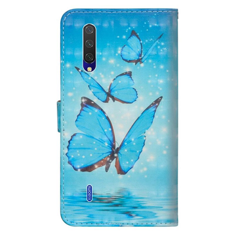 Housse Xiaomi Mi 9 Lite Papillons Bleus Volants